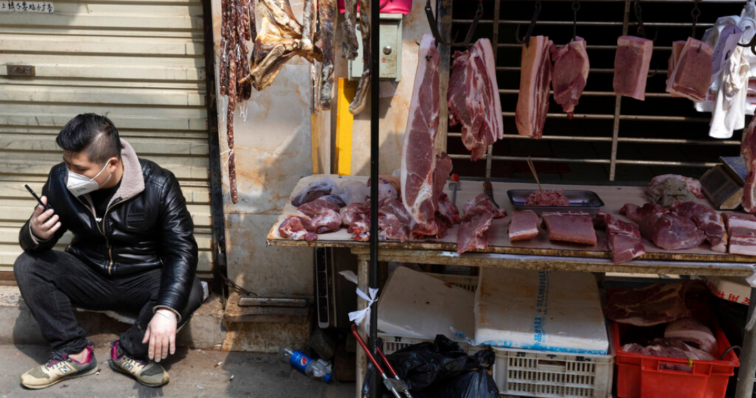 mercado-animales-carne-colgada-calle